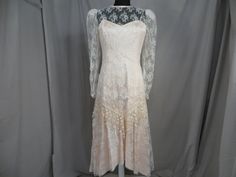 "Wonderful color and feminine styling on this vintage blush pink lace dress. It has a very pretty high neckline. The label is a mystery, only a paper tag sewn on says 11/12 and a code 5414 . Pink lining fabric has a sturdy feel and nice thickness. Lace overlay is sheer. Shape is very feminine, long sleeves with a drop waist. Waist has an extra layer of floral lace. Back zipper. Full skirt. Please convo me for any additional details or photos you would like. Marked size 11/12 but these sizes are Vintage Scalloped Lace Dress For Spring, Spring Vintage Lace Dress With Scalloped Lace, Blush Pink Lace Dress, Kimberbell Designs, Lace Party Dress, Lace Party Dresses, Rose Blush, Flapper Style, Feminine Dress