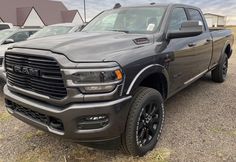 a large gray truck parked in a parking lot