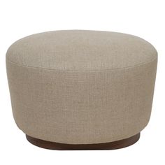 a round ottoman with wooden legs and a beige upholstered fabric cover on it