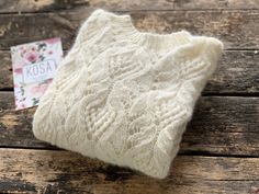 "Openwork woman alpaca pullover. Product Details: * 100% hand knit  * 75% alpaca, 25% merino wool. Regular fit. Size: S(4-6) M(8-10) L(12-14) S Width : 46/48 cm Length: 58/60 cm M Width : 50/52 cm Length: 60 cm L Width : 54 cm Length: 62 cm Please let me know your size. It is made for order.  If you would like me in other size, you could request a custom order with your own parameters: your height, bust and length of the sweater from the shoulder in cm.   Or add your comments about length and сo White Wedding Jacket, White Alpaca, Wedding Sweater, Bridal Sweater, Bridal Jacket, Wedding Jacket, Alpaca Sweater, Star Sweater, Alpaca Yarn