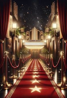 a red carpeted entrance to a theater with stars and lights on the stage curtains