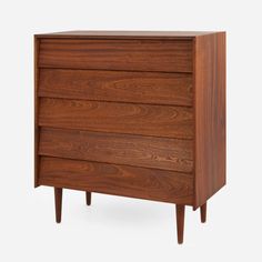 the chest of drawers is made out of wood and has three legs that are attached to each