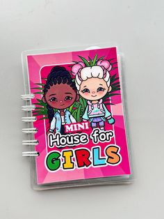 a pink notebook with the words mini house for girls on it and two cartoon characters