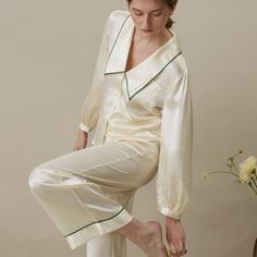 Inspired from the 30’s-40’s chic, this timeless vintage set of suits pants and shirt is a masterpiece of flair. A delicate « Love » french embroidery on the collar was placed to remind you of the great lot of gentleness you are harboring along with your natural elegance. The perfect set to mix & match to transcend the loungewear category.   It is made of 90% Organic Mulberry Silk with low carbon footprint and free of any harmful pollutants & 10% Spandex Pure for a stretch fabric and less wrinkles, which are high quality fabrics for a long-lasting garment.   Exclusive Pearl White color is designed in-house for the Cloud in Summer Series. Versatile look that can be worn outside. Elegant oversize Chelsea collar is with French embroidery “Love” & flattering Doll sleeves design. To clean your s Silk Short Set, Elegant Pyjamas, Loungewear Brand, Elegant Sleepwear, Chelsea Collar, Silk Loungewear, Pajamas Silk, Basic Dress Pattern, Chic Loungewear