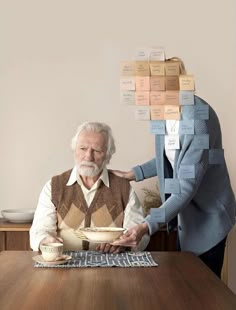 two people sitting at a table with food in front of them and stacked on top of each other