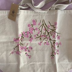 From Brooklyn Botanic Gardens Paintings On Bags, White Canvas Bag For Spring, Spring Floral Print Canvas Bag, Spring Floral Canvas Shopping Bag, Spring Canvas Shopping Bag, Spring Shopping Canvas Bag, Spring Gift Shoulder Bag In Natural Color, Natural Shoulder Bag As Spring Gift, Spring Canvas Gift Bag