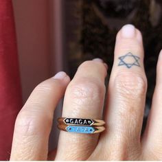 a woman's hand with a ring on it that has the word chicago tattooed on it