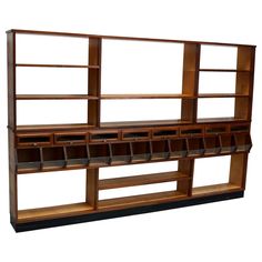 a wooden shelf with several compartments and shelves