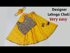 a yellow dress with black dots on it and the words designer lehnga choli very easy