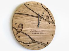 a wooden clock with a bird on it