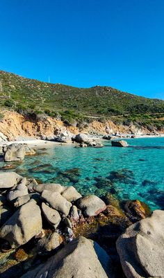 the water is crystal blue and clear with rocks