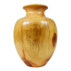 a wooden vase is shown against a white background