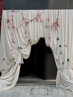 the curtains are covered with pink string lights