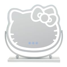 a hello kitty light up mirror on top of a white stand with an image of a cat's head