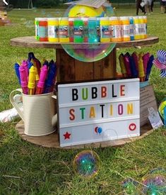 a bubble station is set up in the grass