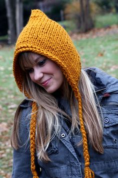 a woman wearing a yellow knitted hat