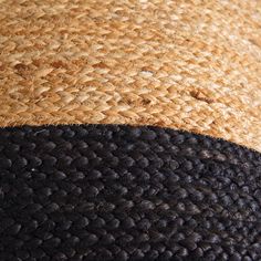 a brown and black hat is sitting on the ground with it's brim