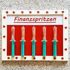 four medical sys are placed in front of a red and white sign that says finansprizen