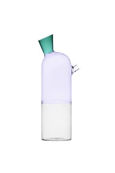 a glass bottle with a green top and white bottom is shown on a white background