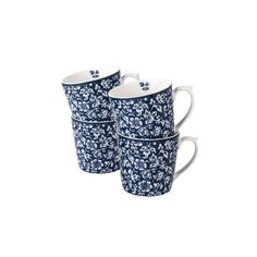 three blue and white mugs with floral designs