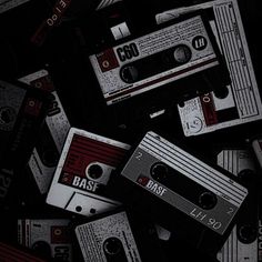 many old cassette tapes are scattered around each other in black and red colors with the word rast on them