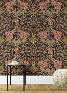 an ornate wallpaper with pink flowers and leaves on black, gold and red colors