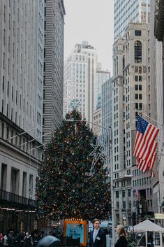 a large christmas tree in the middle of a city