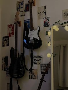 there is a guitar hanging on the wall next to other musical instruments and decorations in this room