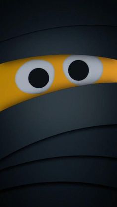 an animated yellow and black object with two eyes on it's side, in the dark