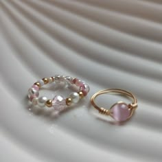 Cute pink wrapping wire ring, rose circular wire ring, bubble gum pink, tarnish resistant wire ring, boho seed bead ring, pretty pink ring Beautiful rings for any occasion. Choose the size of your ring in the personalization box. For greater durability avoid putting them in water. if you have any question about the rings let me know. Dainty Pink Stackable Promise Rings, Delicate Pink Stackable Rings For Gifts, Cute Pink Round Rings, Pink Hand Wrapped Round Bead Jewelry, Pink Hand Wrapped Round Beads Jewelry, Hand Wrapped Pink Round Beads Jewelry, Hand Wrapped Pink Round Bead Jewelry, Cute Pink Rings For Promise, Tiny Pink Promise Ring