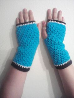 Bright aqua crocheted fingerless gloves, textured stitch, bordered in white and black, light weight ,great for spring. LOVE them.Free shipping within U.S. and $5.00 for Canadian Customers  Price : $10.00 Crocheted Fingerless Gloves, Spring Love, Crochet Fingerless Gloves, Black Light, Fingerless Gloves, Arm Warmers, White And Black, Gloves, Texture