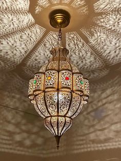 a chandelier hanging from the ceiling in a room