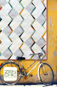 a bicycle is parked in front of a wall hanging on the side of a building