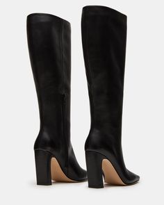 Expertly constructed, the LIZETTE boot is designed with a sleek knee-high silhouette, square toe, and stylish heel. This boot is durable and fashionable, making it the perfect addition to any wardrobe. Elevate your look with these timeless boots. 3.5 inch heel height Size 6 measurements: 16.5 inch shaft circumference, 14.25 inch shaft height Size 8 measurements: 17.25 inch shaft circumference, 14.75 inch shaft height Size 10 measurements: 18 inch shaft circumference, 15.25 inch shaft height Leat Wide Calf Knee High Boots, Timeless Boots, Stylish Heels, Shoe Fits, Wide Calf, 5 Inch Heels, Elevate Your Look, Fun Bags, Knee High Boots