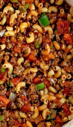 a casserole dish filled with pasta and ground beef