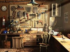 a workbench filled with lots of tools and assorted items on the wall