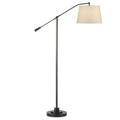 a floor lamp with a white shade on the base and a black metal pole,