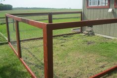 a wooden fence in front of a house