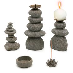 a candle is lit next to some rocks