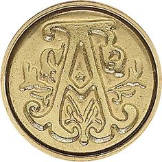 a gold button with the letter a in it's center and an ornate design