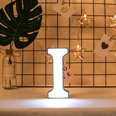 a lighted letter is sitting on a table