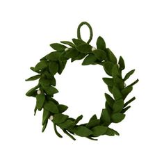 a green wreath with white flowers and leaves