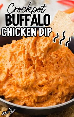 a bowl full of buffalo chicken dip with crackers on the side and text overlay that reads, crockpot buffalo chicken dip