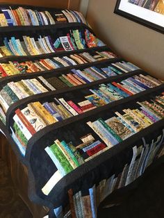 two beds covered in books sit next to each other