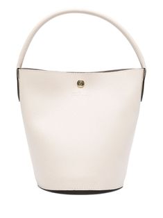 light beige leather textured finish bucket body single rolled top handle main compartment suede lining logo-engraved gold-tone hardware press-stud fastening This piece comes complete with a protective dust bag. Cream Bucket Bags With Gold-tone Hardware, Bucket Bag With Metal Hardware For Daily Use, Chic Everyday Top Handle Bucket Bag, Daily Use Bucket Bag With Metal Hardware, Cream Bucket Bag Tote With Gold-tone Hardware, Beige Bucket Bag With Gold-tone Hardware For Shopping, Classic White Bucket Bag, Cream Tote Bucket Bag With Gold-tone Hardware, Beige Bucket Shoulder Bag With Gold-tone Hardware