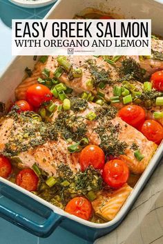 an easy greek salmon dish with tomatoes and green onions in a blue casserole dish