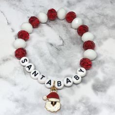 This darling SANTA 🎅🏻 BABY stretch bracelet is so darling!  It's made with gorgeous, sparkly ✨ ❤️🤍 crystal glass rondelles & a darling enamel Santa 🎅🏻 charm. It's so fun and festive️🤍.  It measures 7 inches in length on 100% polyester stretch cord, not wire. Natal, Bracelet En Cuir Diy, Christmas Jewelry Diy, Baby Santa, Snowflake Bracelet, Clay Bead Necklace, Holiday Bracelets, Diy Leather Bracelet, Diy Jewelry Display