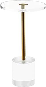 a round glass table with a gold metal pole on the top, and a white background