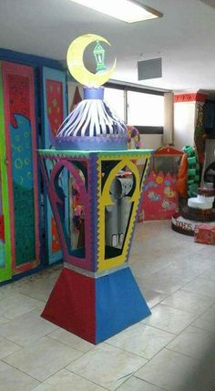 a brightly colored carousel in the middle of a room with lots of art on it