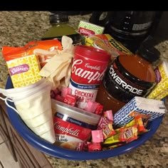 a blue bowl filled with snacks and condiments